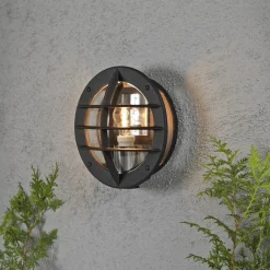 Konstsmide Oden vegglampe utendørs IP23 m/stikkontakt - Svart/klart glass Svart / Klar